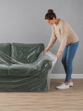 Skydda 3-sits soffa med möbelskydd i plast